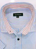 Close-up of a striped shirt with a brand label on a white background