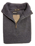 Gray sweater with a brand tag on a white surface