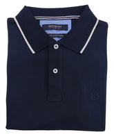 Folded navy blue polo shirt with white trim on a light gray background
