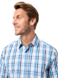 Man wearing a blue and white checkered shirt against a light gray background
