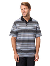 Man wearing a striped polo shirt against a plain background