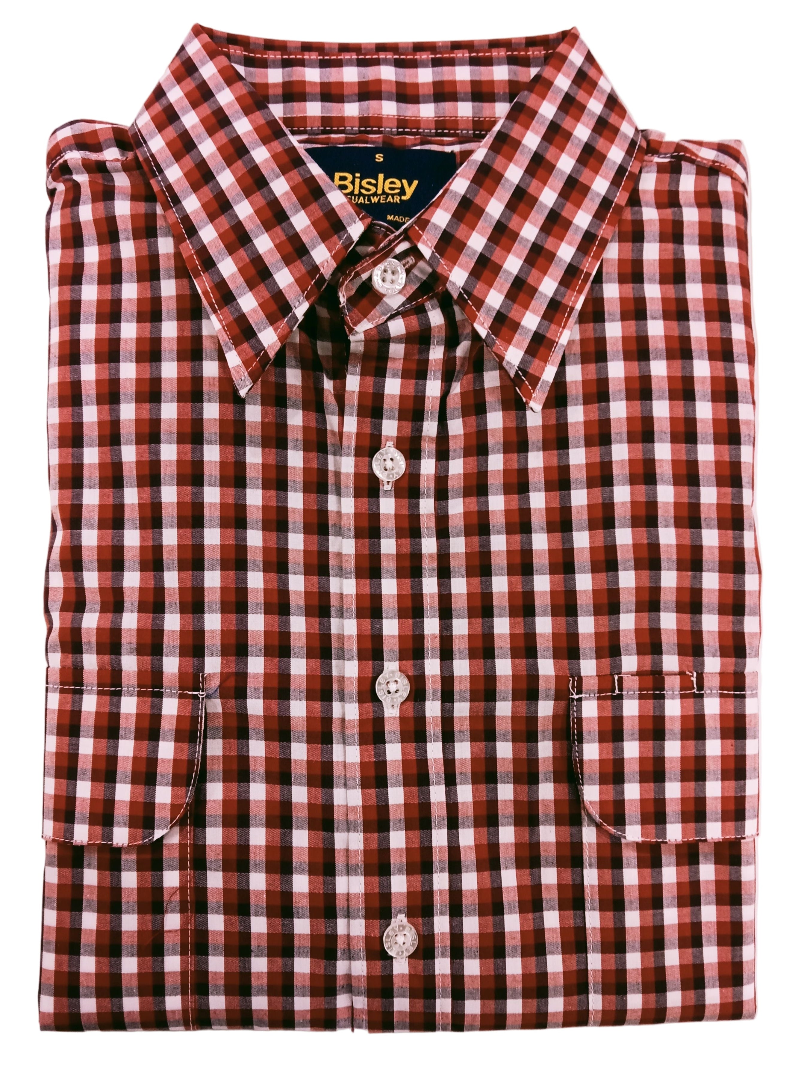 Folded red and white checkered shirt with 'Bisley' branding on a light pink background