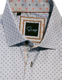 Folded shirt with a patterned collar and visible brand logo on a white background
