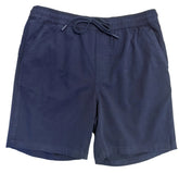 A pair of dark navy blue drawstring shorts laid flat on a white surface, with a person's legs visible at the bottom edge.