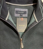 Folded dark gray jacket with a brand tag on a light background