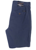 A pair of dark navy blue shorts with a textured pique knit fabric, featuring a back pocket with a button closure and a visible 'Vest' brand tag.
