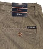 Close-up of a pair of olive green textured pants with a branded paper tag at the waistband and a small 'Le SHORT' label on the back pocket.