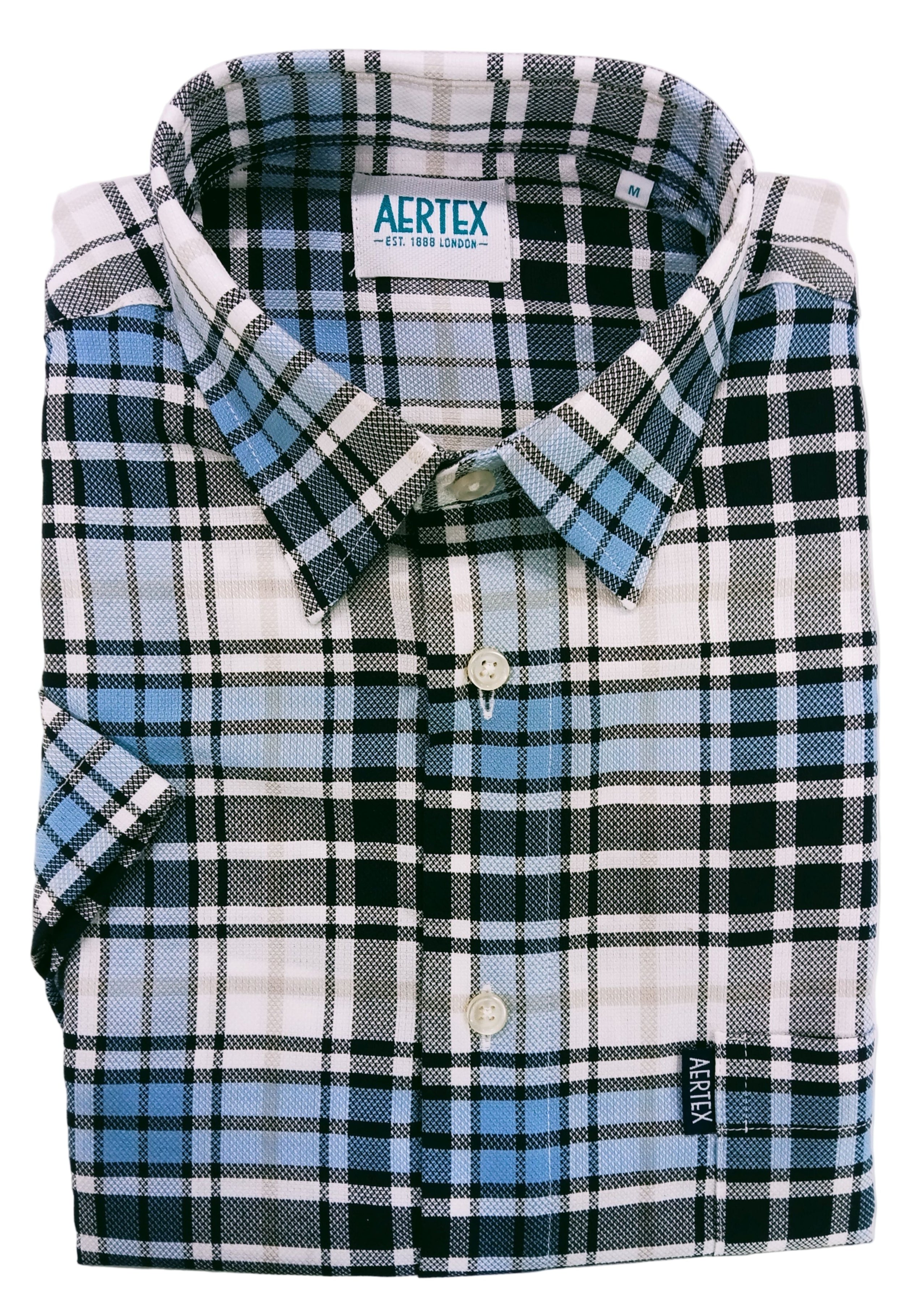 Folded plaid shirt with brand label on a white background