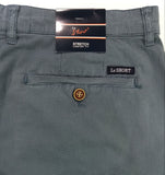 Close-up of gray shorts with a brand label on a white background