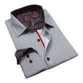 Folded shirt with patterned interior and tie on a white background