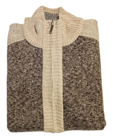 Folded sweater with a color block design on a white surface.