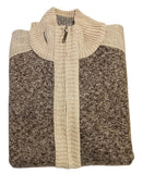 Folded sweater with a color block design on a white surface.