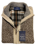 Folded jacket with a brand tag on a white surface