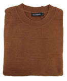 Folded brown sweater with a brand label on a white background