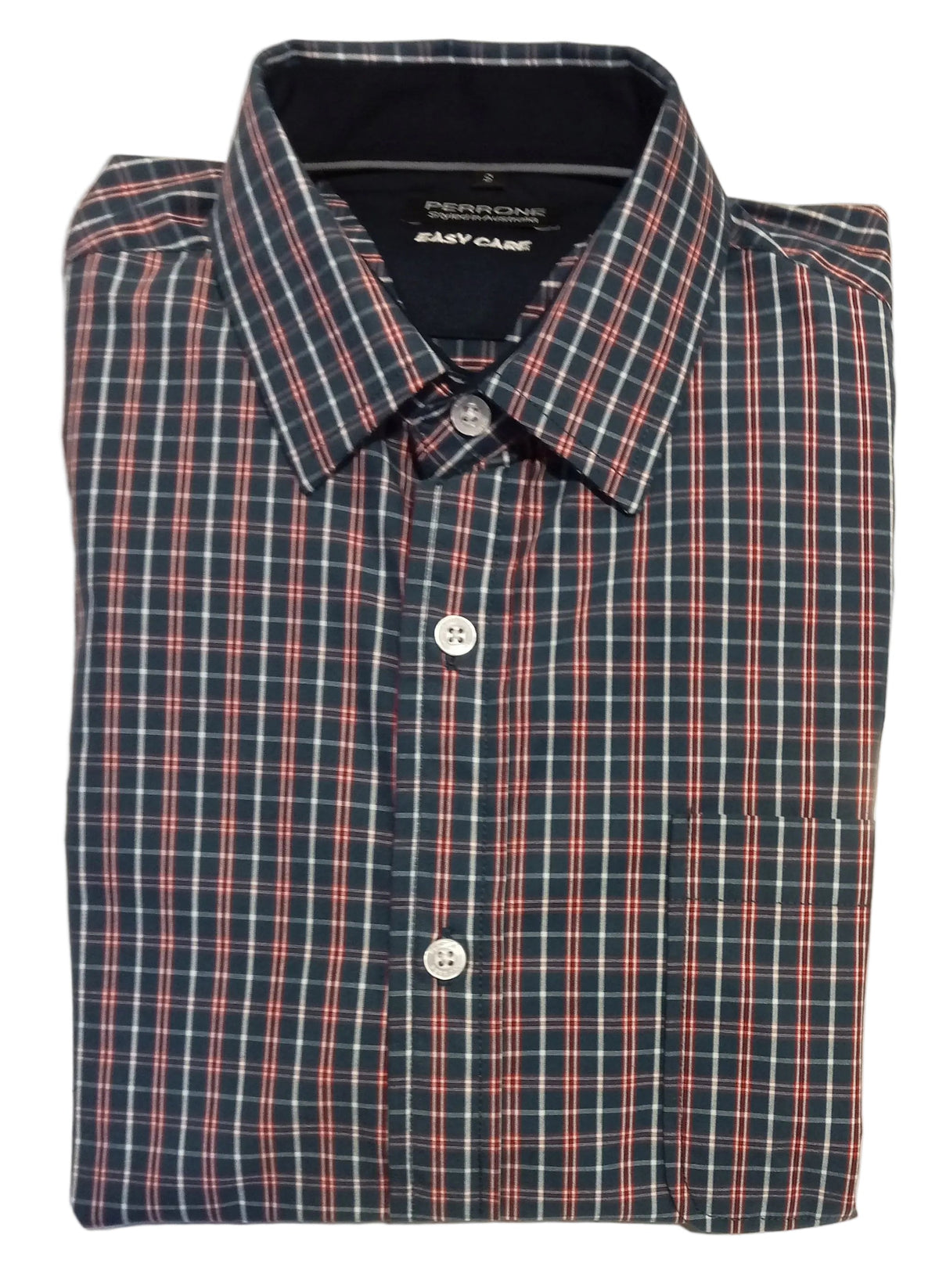 Folded plaid shirt on a white surface with a blurred background