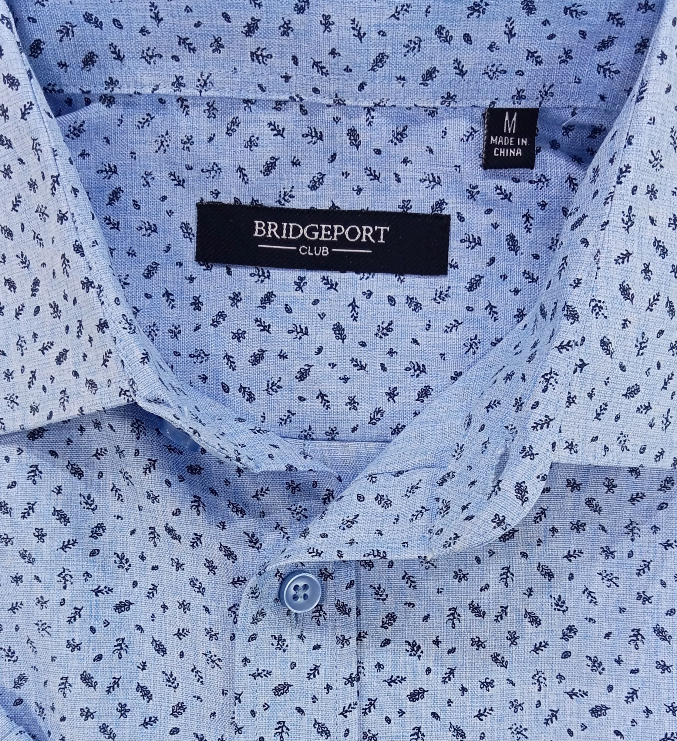 Light blue shirt with subtle pattern on a white background