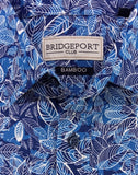 Blue patterned shirt with a visible brand label on a white background