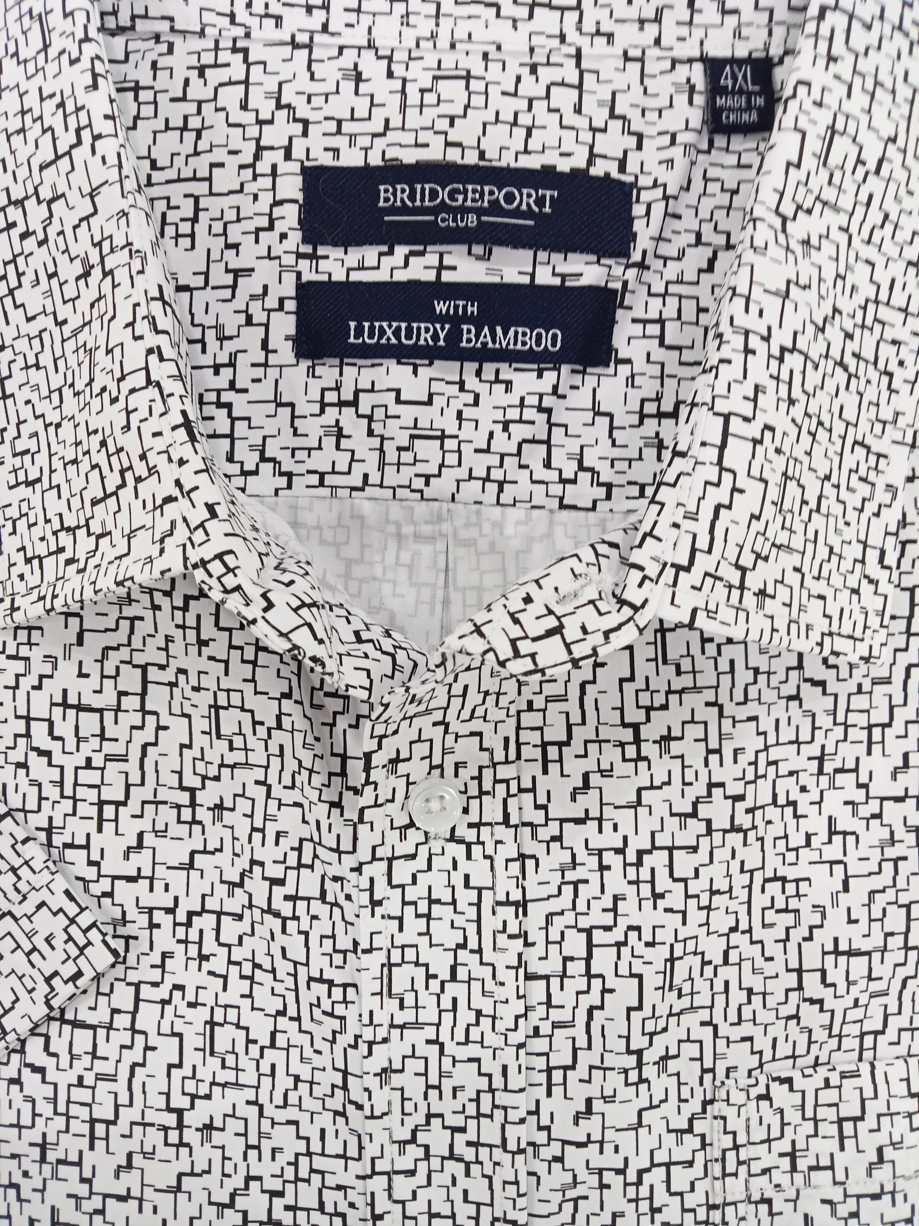 Close-up of a shirt with Bridgeport Club labels on a white and black patterned fabric.
