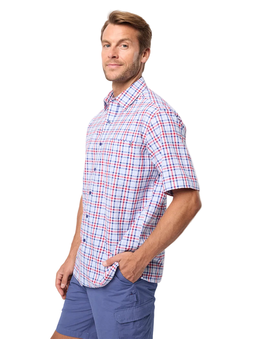 Man wearing a plaid shirt and blue shorts on a white background