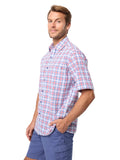 Man wearing a plaid shirt and blue shorts on a white background