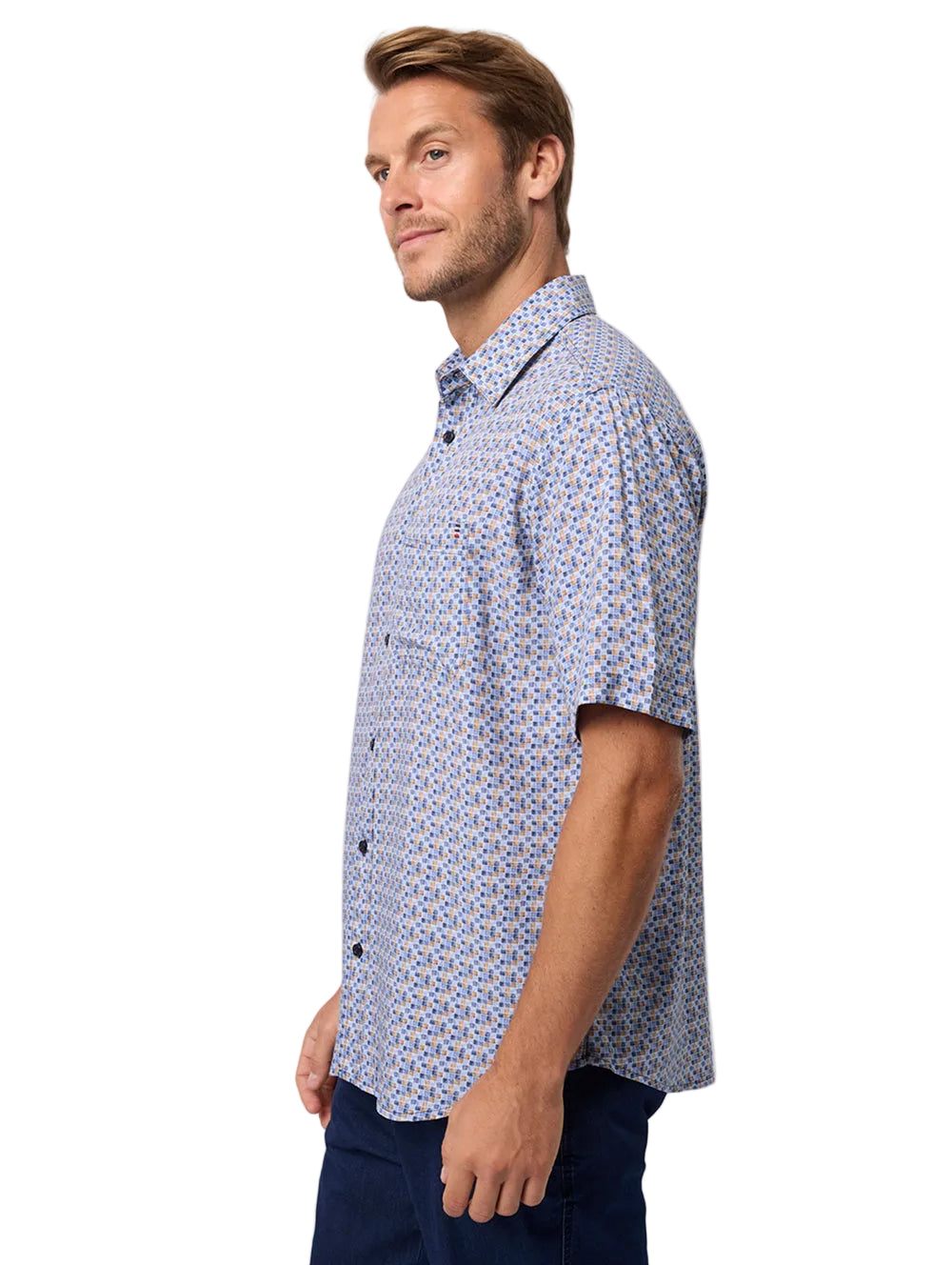 Man wearing a blue patterned shirt on a white background