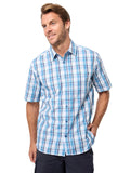 Man wearing a blue and white checkered shirt on a light gray background