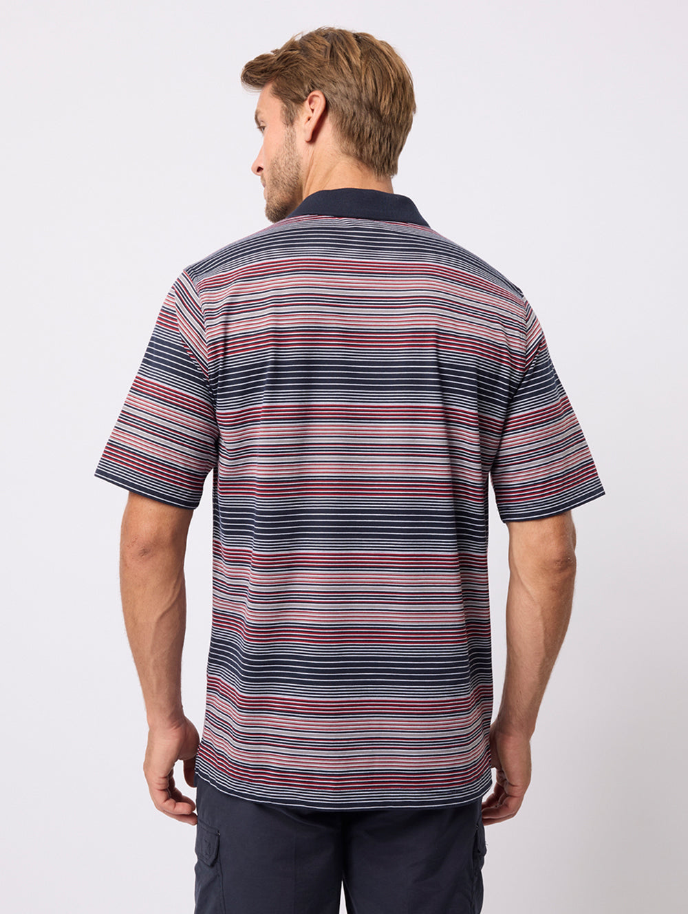 Man wearing a striped polo shirt on a white background