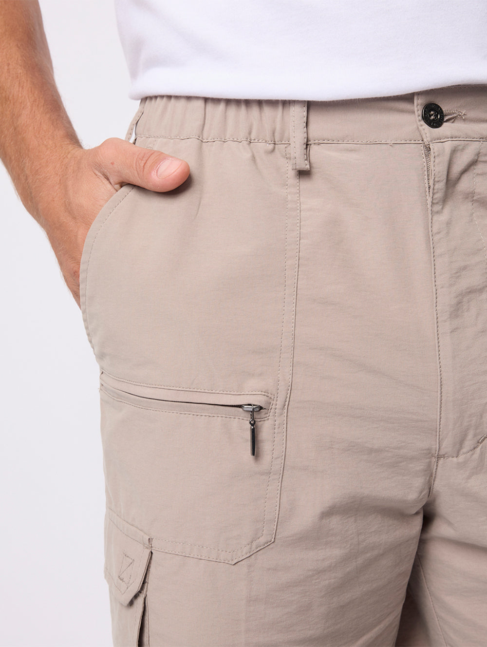 Beige cargo pants with a white background