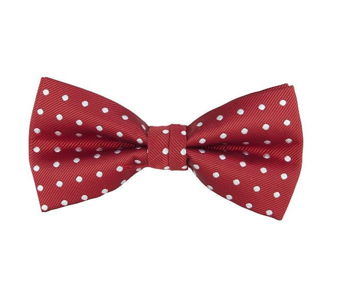 Red bow tie with white polka dots on a white background