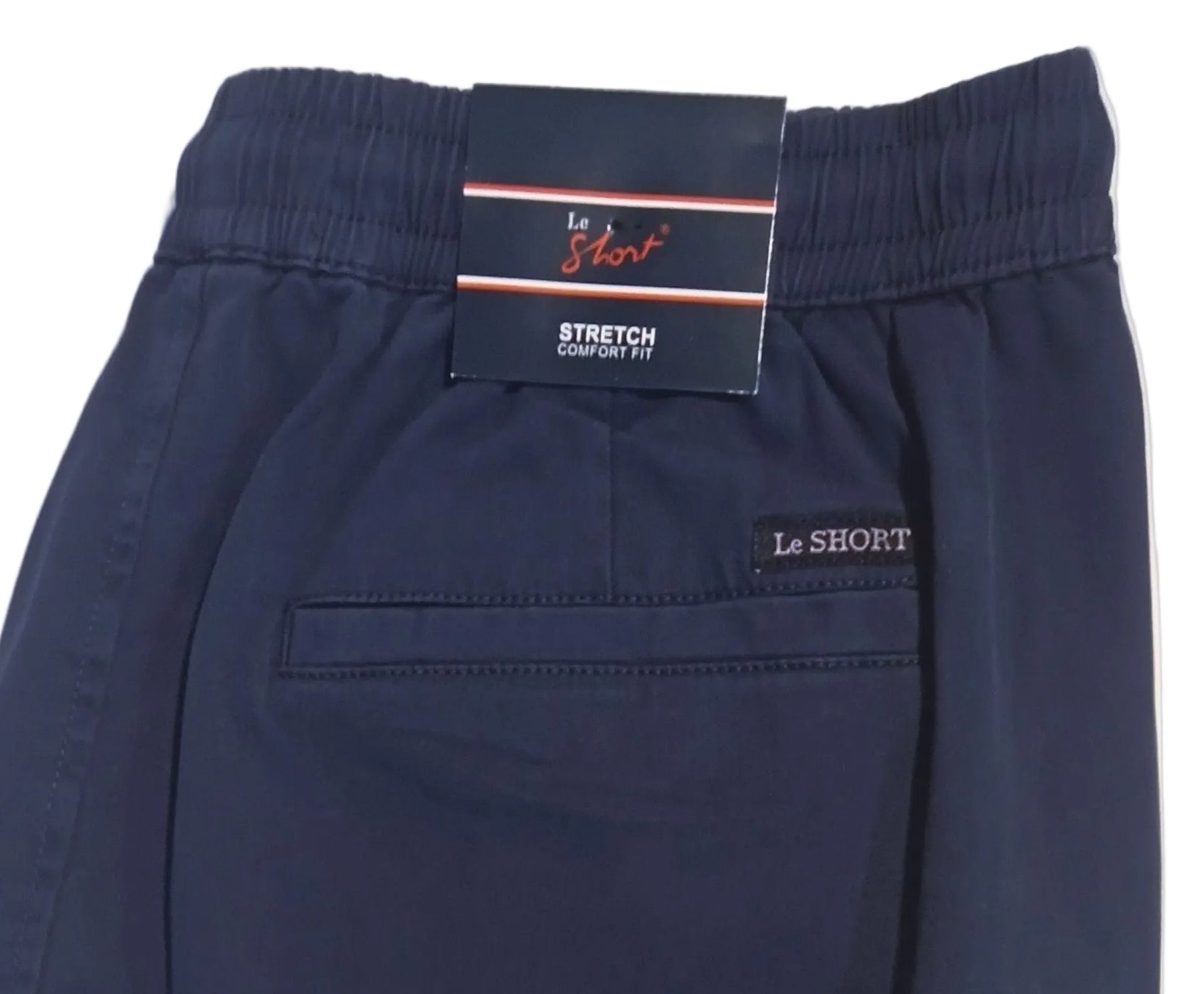 A pair of dark navy blue shorts with an elastic waistband, laid flat on a white surface. The brand name 'LE SHORT' is visible on both the inner waistband label and embroidered on the side pocket.