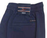 A pair of dark navy blue shorts with an elastic waistband, laid flat on a white surface. The brand name 'LE SHORT' is visible on both the inner waistband label and embroidered on the side pocket.