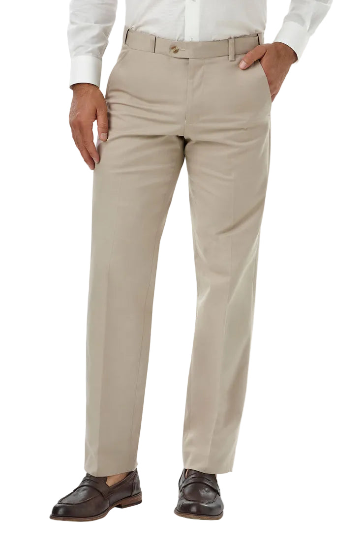 Person wearing beige dress pants with a white shirt on a plain background