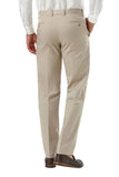 A person shown from the back wearing light beige chinos with a white dress shirt and dark brown loafers, photographed against a light gray studio background.