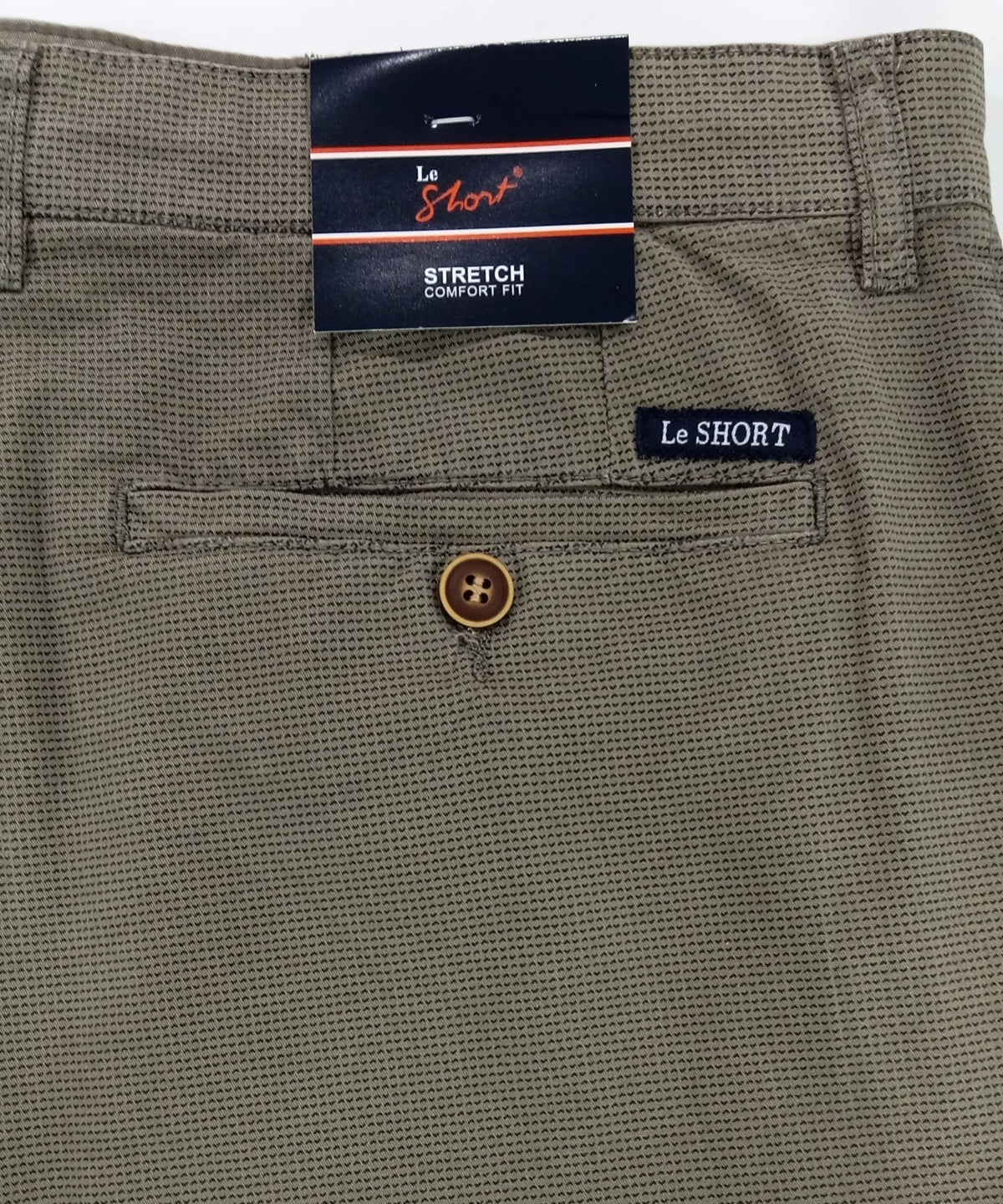 Green shorts with a brand label on a white background