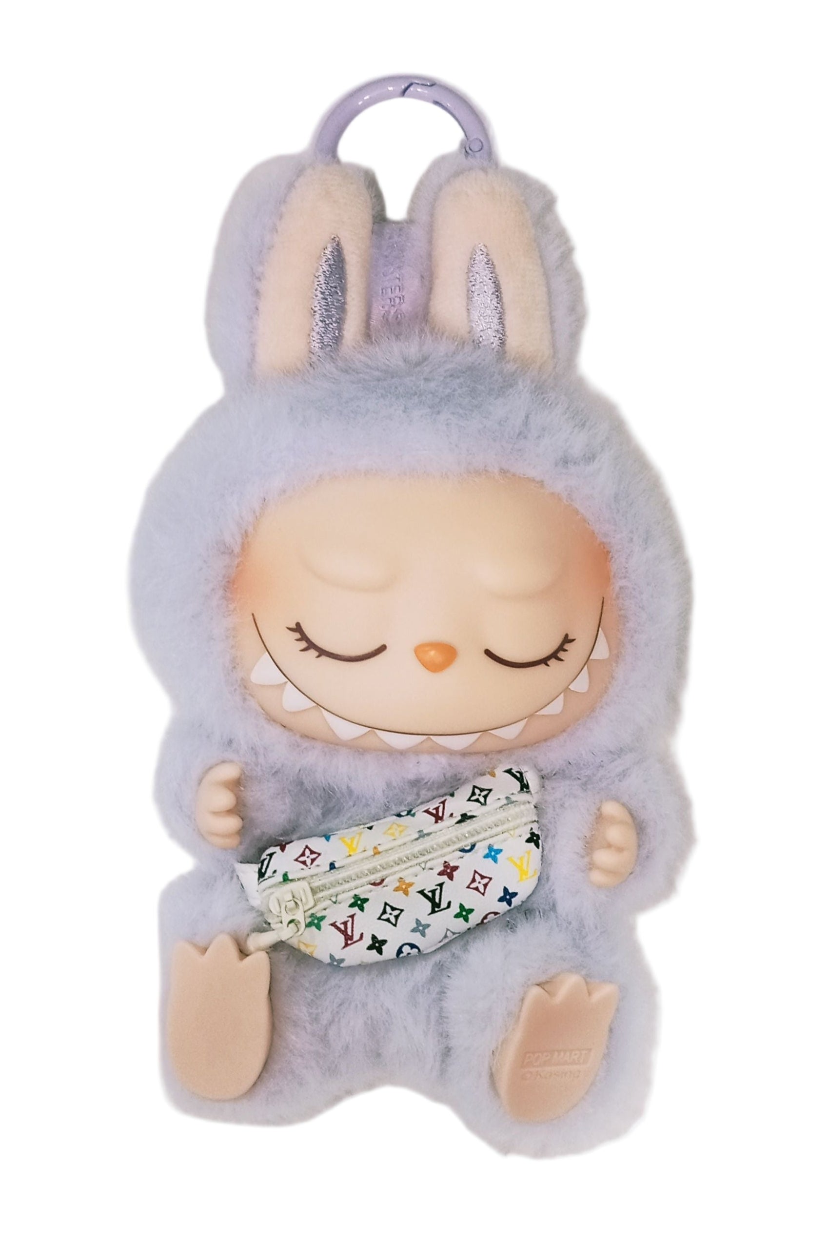 Plush toy with a baby face and floral bib on a light gray background