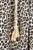 Leopard print fabric with a tassel detail
