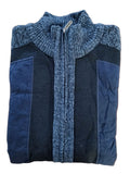 Folded blue and black jacket on a wooden surface