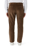 Brown corduroy pants worn by a person on a white background