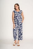 Woman wearing a blue and white patterned jumpsuit on a white background