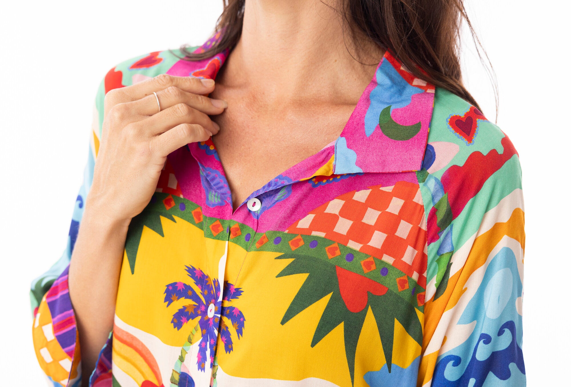 Colorful patterned shirt worn by a person on a white background