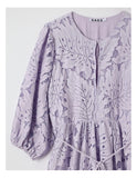 Lavender floral dress with long sleeves on a white background