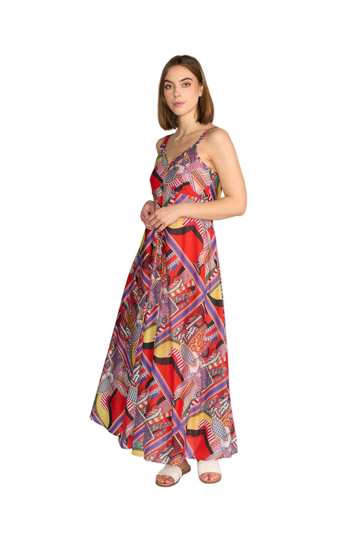 Woman wearing a colorful patterned dress on a white background