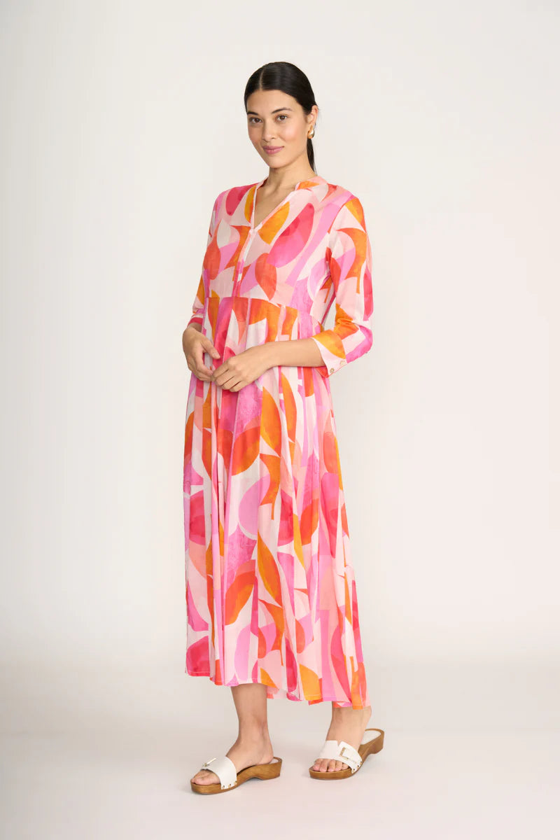 Woman wearing a colorful dress on a white background