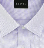 Folded light purple dress shirt with white collar and cuffs on a white background