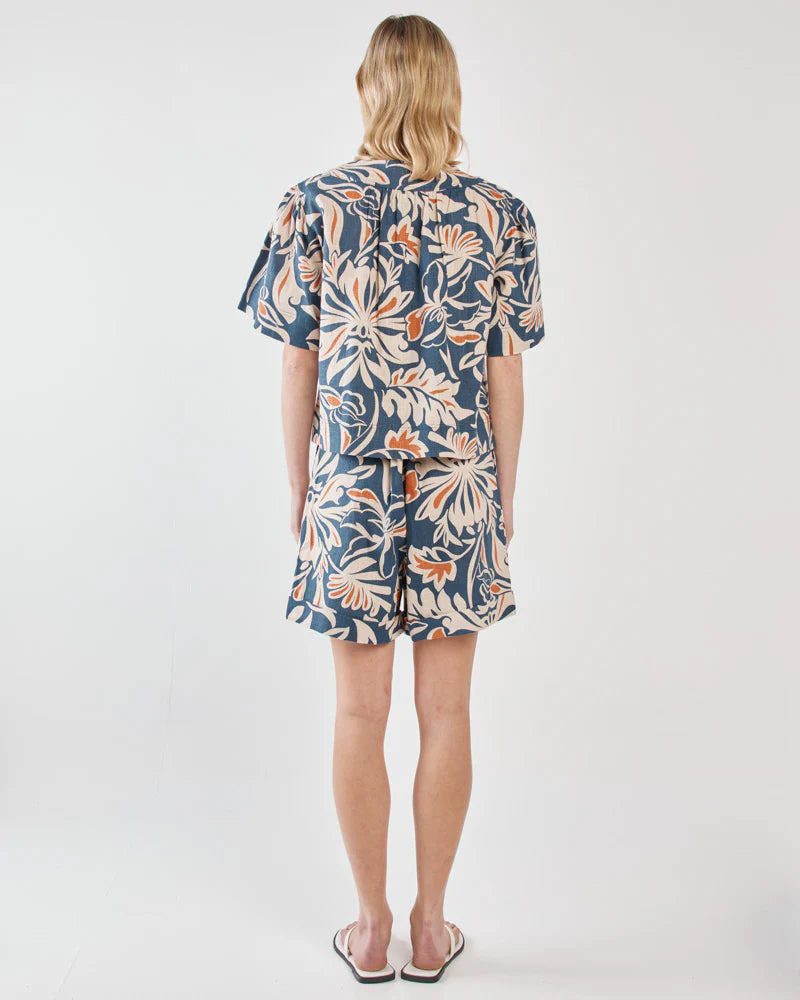 Woman wearing a floral dress on a white background