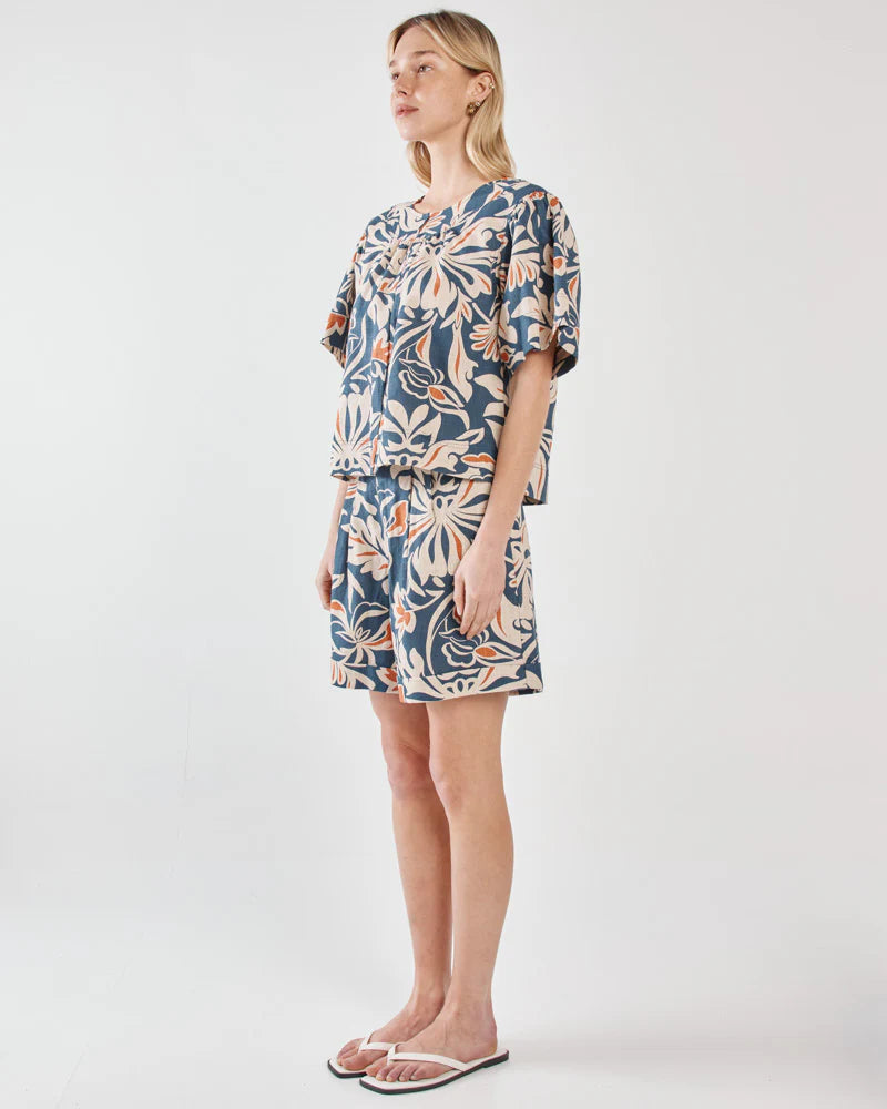 Woman wearing a floral dress on a white background
