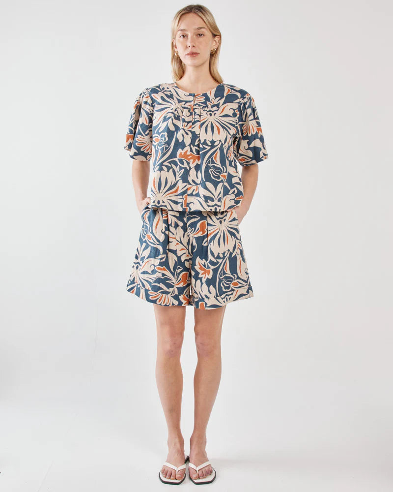 Woman wearing a floral dress on a white background