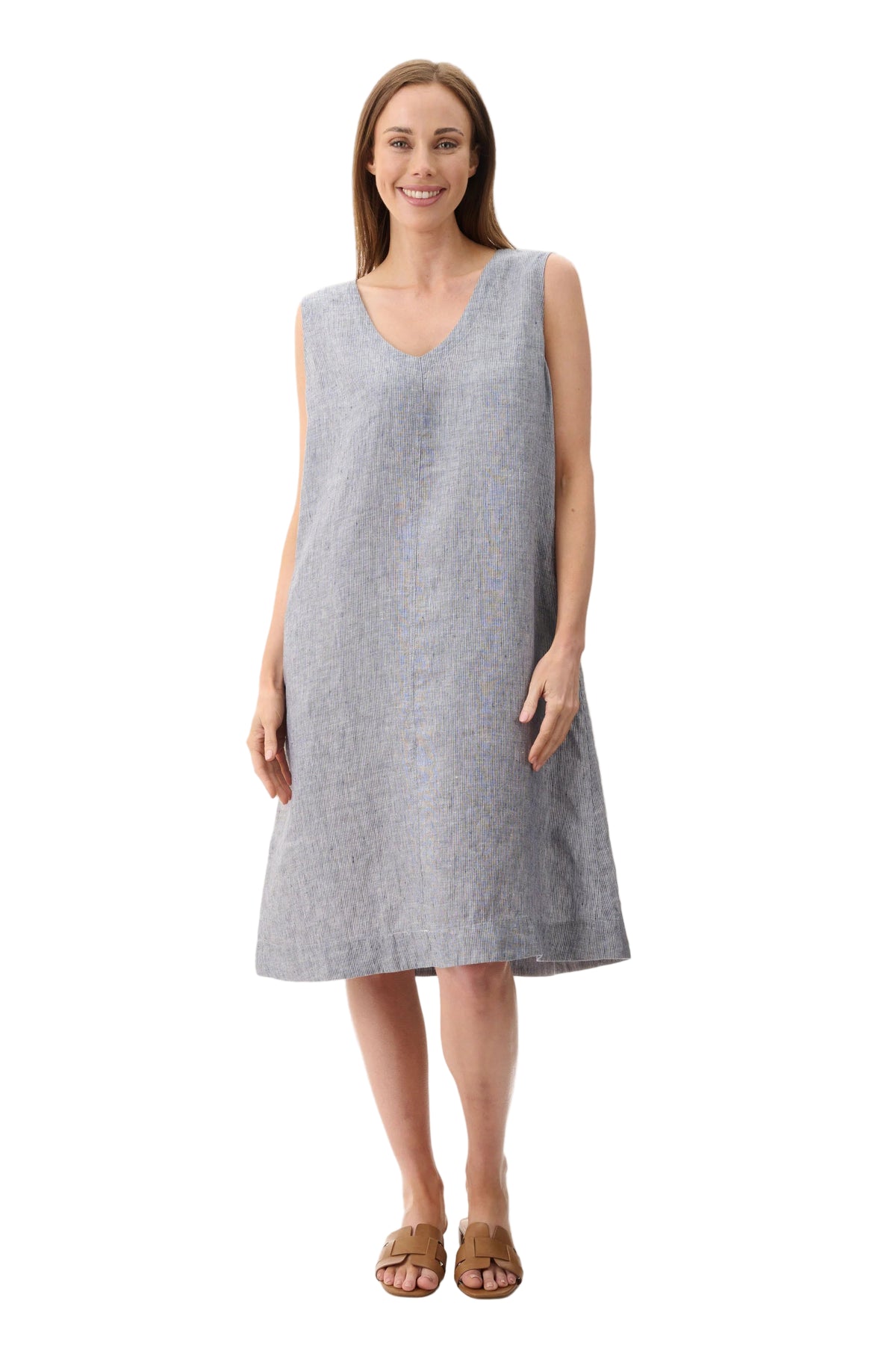 Woman wearing a gray sleeveless dress on a light beige background