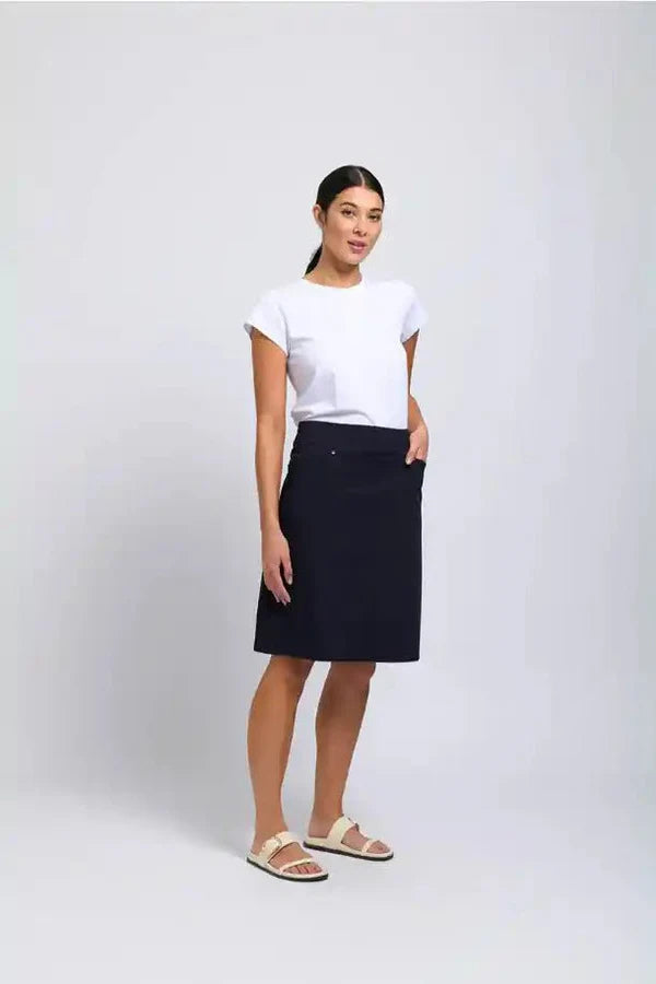 Person wearing a white t-shirt and black skirt on a white background